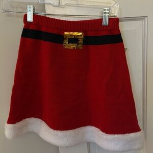 Holiday skirt xs
Waist is
Length of skirt 15 inches